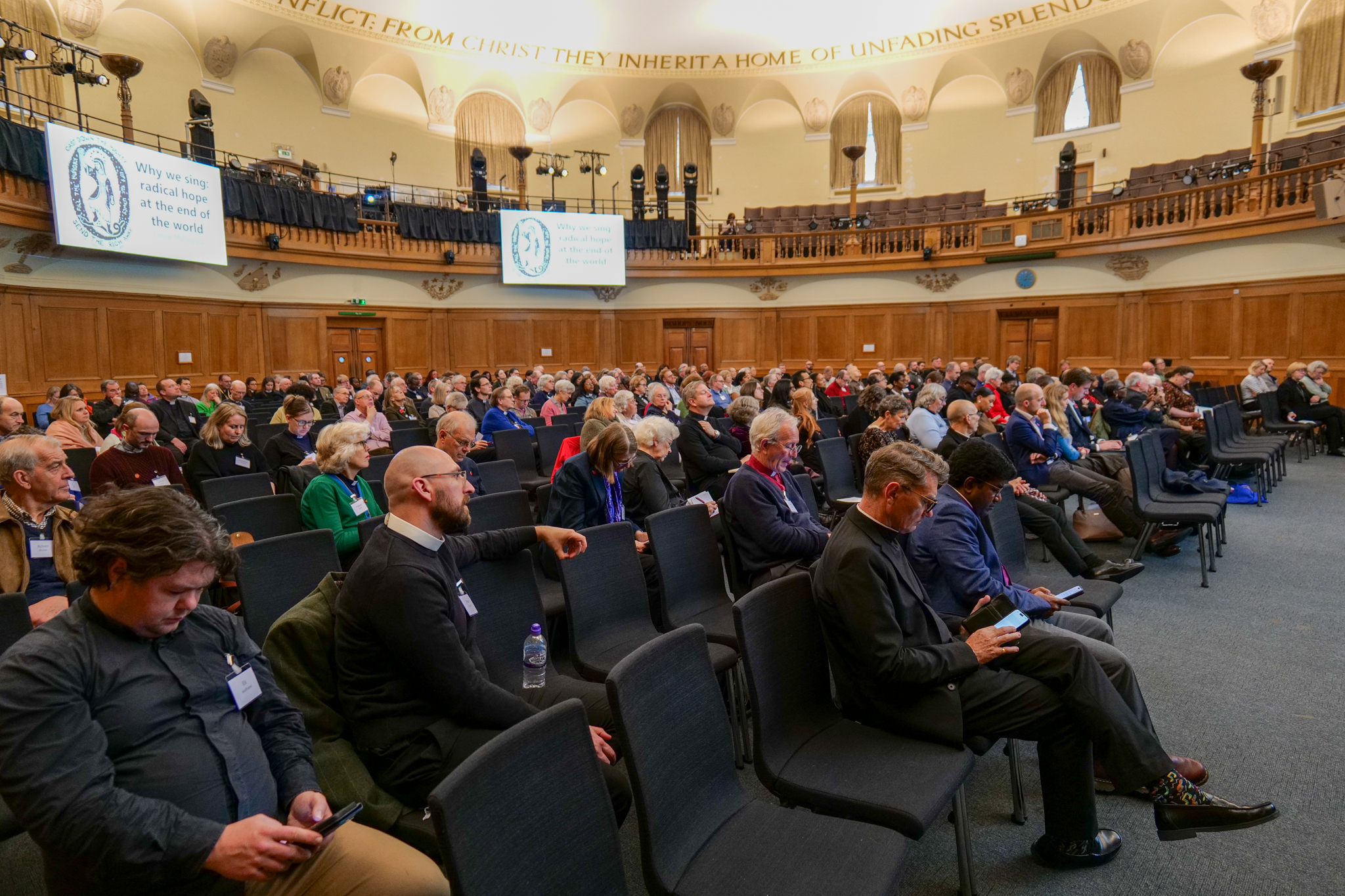 Large congregation attending a church conference and prayer gathering